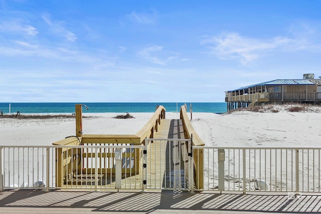 exterior space with a beach view and a water view