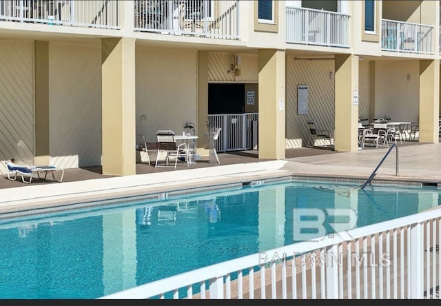 pool with a patio