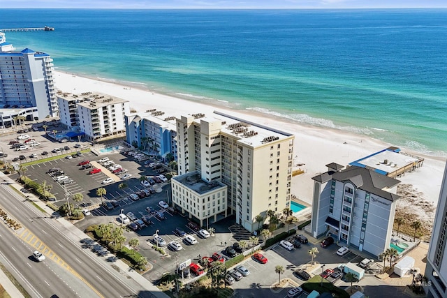 aerial view featuring a view of city, a water view, and a view of the beach