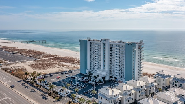 aerial view featuring a water view and a view of the beach