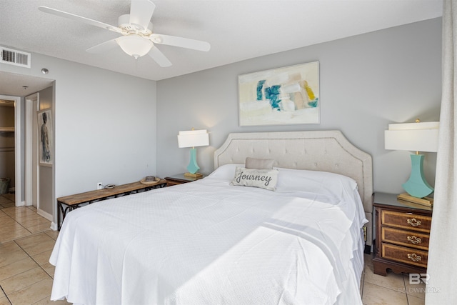 bedroom featuring light tile patterned flooring and ceiling fan
