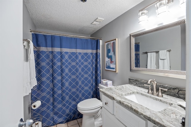 bathroom with walk in shower, tile patterned floors, toilet, a textured ceiling, and vanity