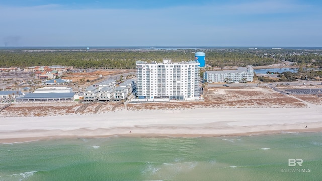birds eye view of property featuring a water view and a view of the beach