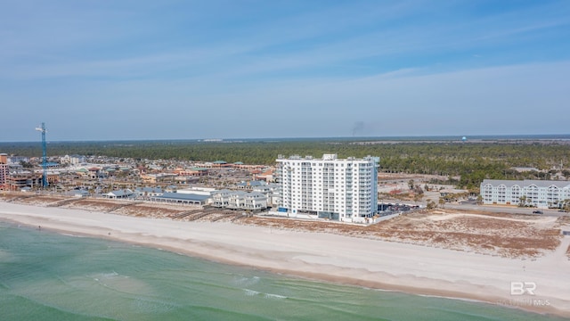 drone / aerial view featuring a water view and a beach view