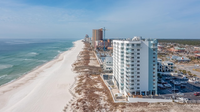 bird's eye view featuring a beach view and a water view