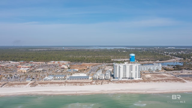 drone / aerial view featuring a beach view and a water view