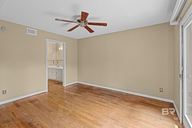 389 Clubhouse Dr Unit 4R, Gulf Shores, AL 36542 - unfurnished room featuring a ceiling fan, light wood-type flooring, baseboards, and a sink