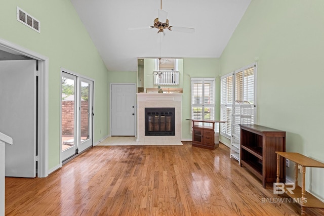 389 Clubhouse Dr Unit 4R, Gulf Shores, AL 36542 - living room featuring a fireplace, a ceiling fan, high vaulted ceiling, wood finished floors, and baseboards