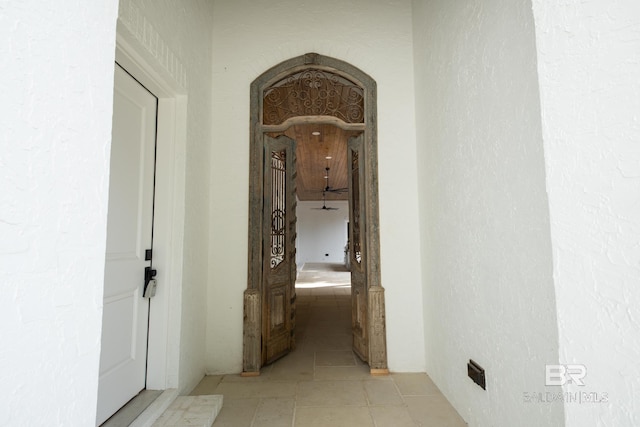 corridor featuring light tile patterned flooring