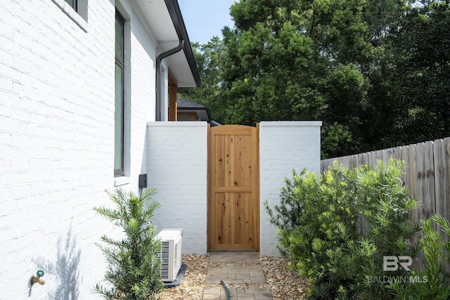 view of gate featuring ac unit