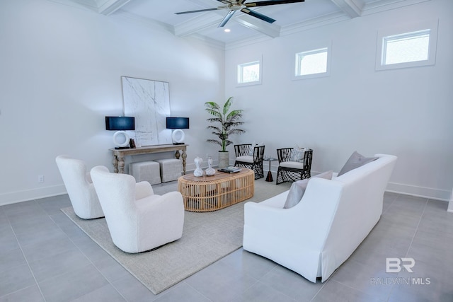 living room featuring tile patterned flooring, ornamental molding, ceiling fan, beam ceiling, and coffered ceiling