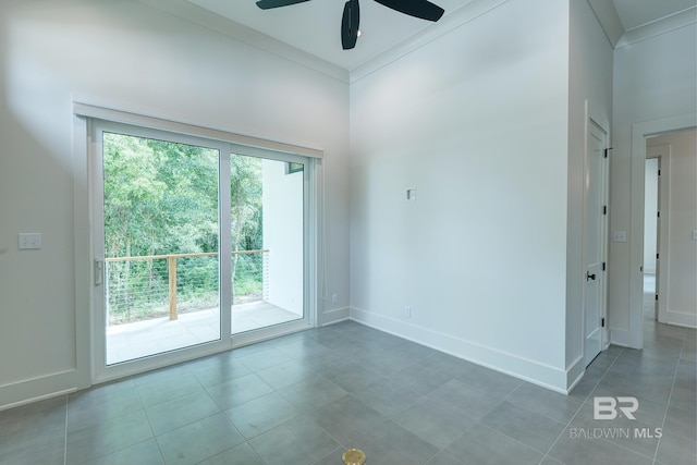 tiled spare room with ceiling fan and ornamental molding