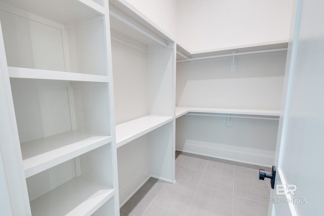 walk in closet featuring light tile patterned floors