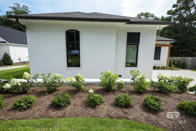 view of side of property with a patio area