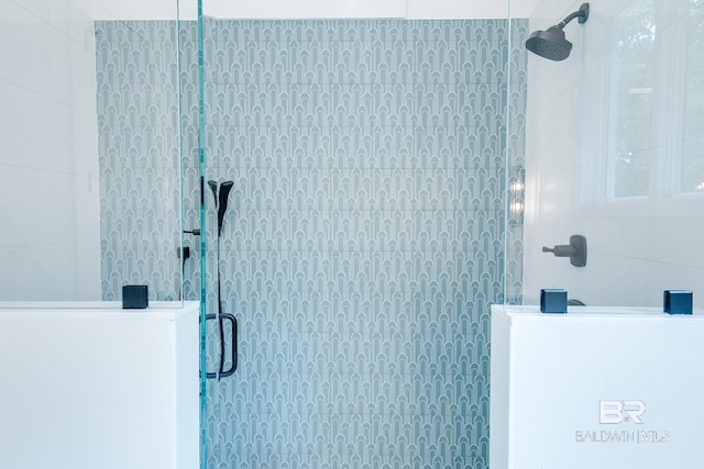 bathroom with tiled shower