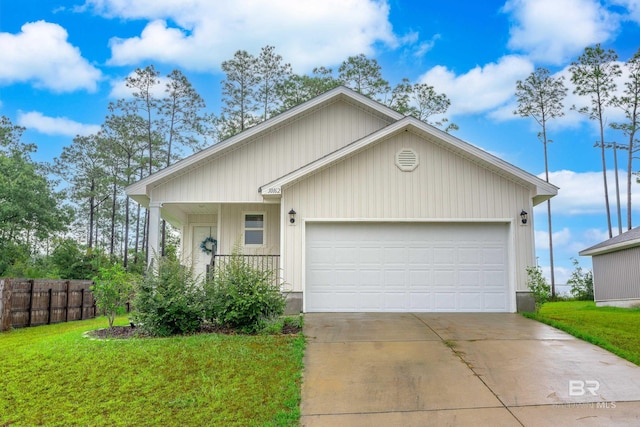 view of front facade with a front yard and a garage