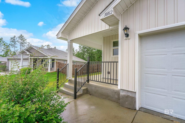 exterior space with a garage and covered porch