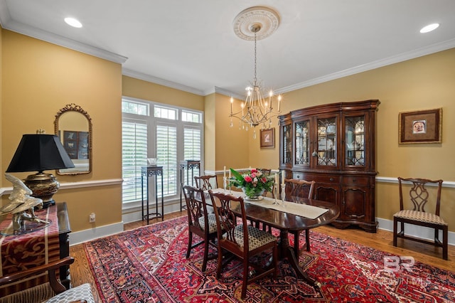 137 Mcintosh Bluff Rd, Fairhope, AL 36532 - dining area with a chandelier, wood finished floors, baseboards, ornamental molding, and recessed lighting