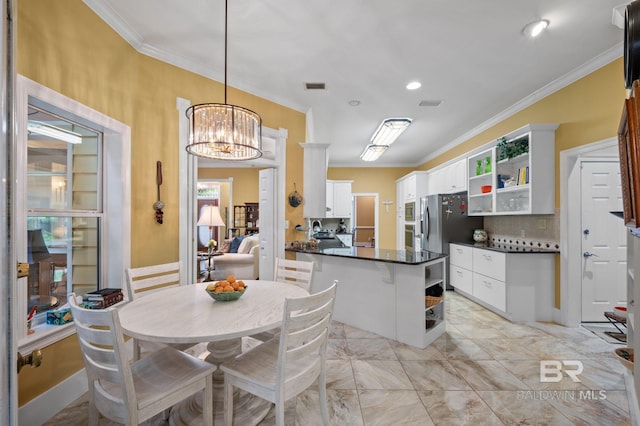 137 Mcintosh Bluff Rd, Fairhope, AL 36532 - dining room with ornamental molding, a chandelier, and light marble finish flooring