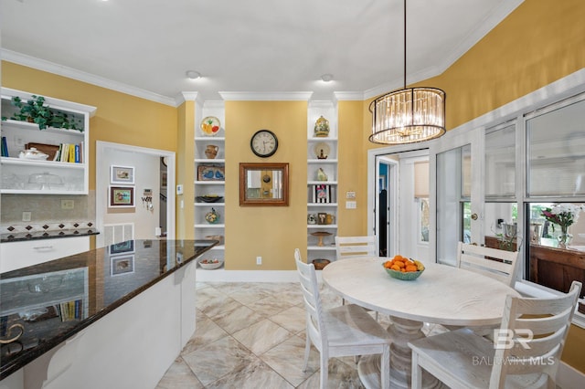 137 Mcintosh Bluff Rd, Fairhope, AL 36532 - dining space featuring ornamental molding, built in shelves, a chandelier, and light marble finish flooring