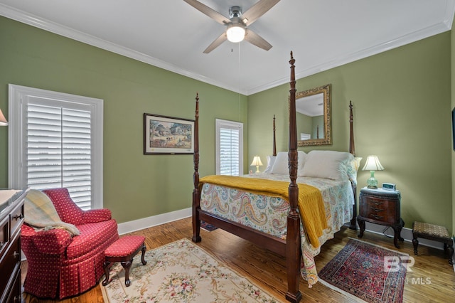137 Mcintosh Bluff Rd, Fairhope, AL 36532 - bedroom featuring crown molding, baseboards, wood finished floors, and ceiling fan