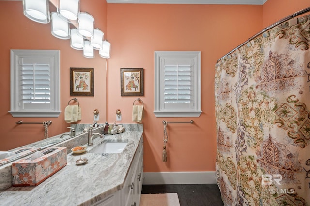 137 Mcintosh Bluff Rd, Fairhope, AL 36532 - bathroom with baseboards, vanity, a chandelier, and tile patterned floors