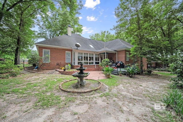 137 Mcintosh Bluff Rd, Fairhope, AL 36532 - rear view of property with brick siding, fence, a chimney, and a patio area