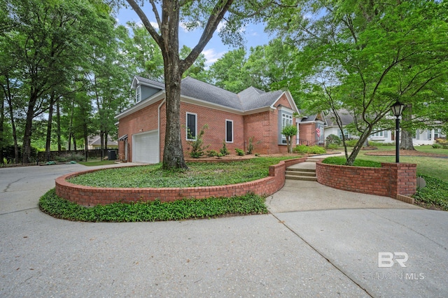 137 Mcintosh Bluff Rd, Fairhope, AL 36532 - view of side of property featuring brick siding, a garage, and fence