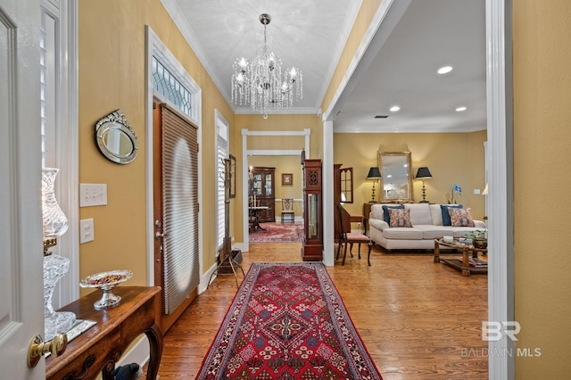 137 Mcintosh Bluff Rd, Fairhope, AL 36532 - foyer entrance featuring wood finished floors, crown molding, a chandelier, and recessed lighting