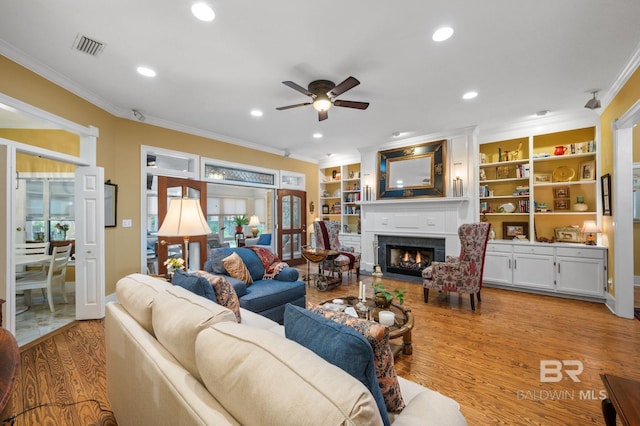 137 Mcintosh Bluff Rd, Fairhope, AL 36532 - living area featuring crown molding, ceiling fan, a fireplace with flush hearth, wood finished floors, and recessed lighting