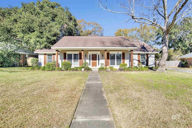 ranch-style house featuring a porch and a front yard