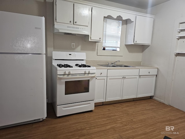 kitchen with white cabinetry, white appliances, dark hardwood / wood-style floors, and sink