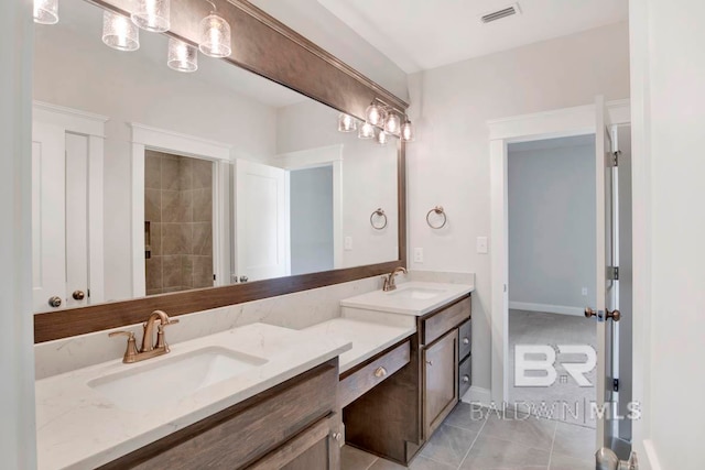 bathroom with vanity and tile patterned flooring