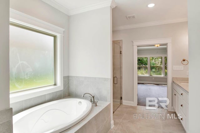 bathroom featuring independent shower and bath, vanity, tile patterned floors, and crown molding