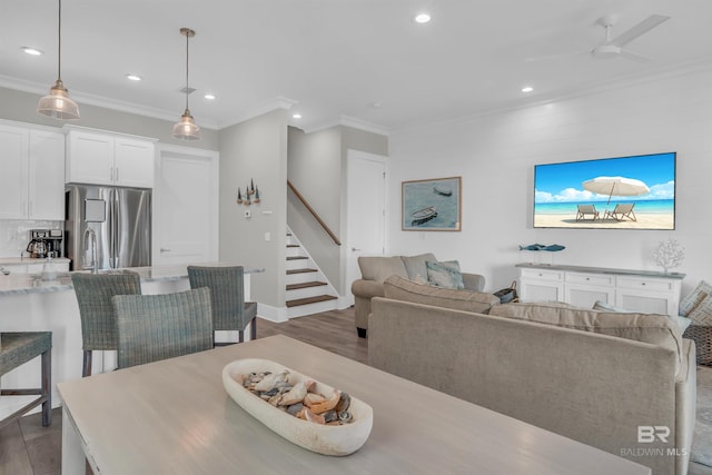 1592 W Beach Blvd, Gulf Shores, AL 36542 - dining area featuring hardwood / wood-style flooring, ceiling fan, and ornamental molding
