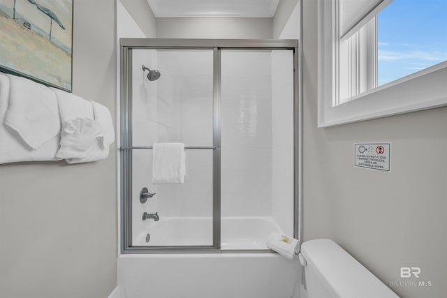 1592 W Beach Blvd, Gulf Shores, AL 36542 - bathroom with toilet and enclosed tub / shower combo
