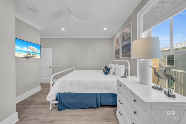 1592 W Beach Blvd, Gulf Shores, AL 36542 - bedroom featuring ceiling fan, light hardwood / wood-style floors, and ornamental molding