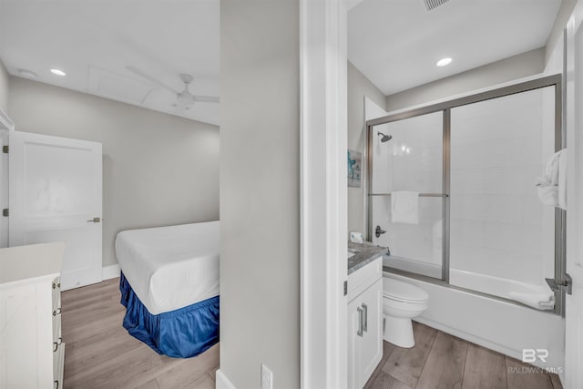 1592 W Beach Blvd, Gulf Shores, AL 36542 - full bathroom with vanity, toilet, combined bath / shower with glass door, and ceiling fan