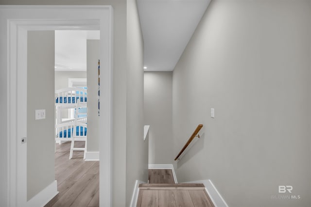 1592 W Beach Blvd, Gulf Shores, AL 36542 - staircase with hardwood / wood-style flooring