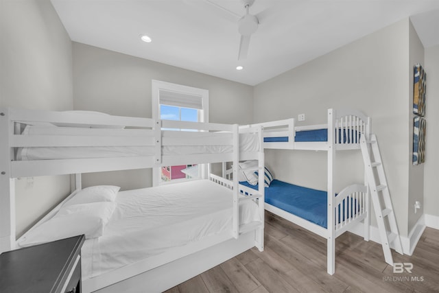1592 W Beach Blvd, Gulf Shores, AL 36542 - bedroom with ceiling fan and hardwood / wood-style flooring