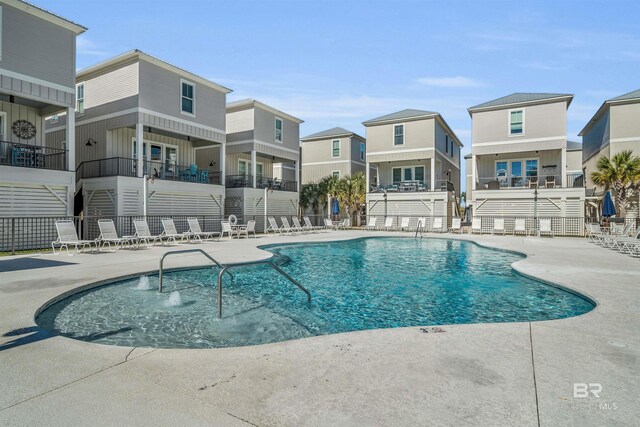 1592 W Beach Blvd, Gulf Shores, AL 36542 - view of swimming pool with a patio area