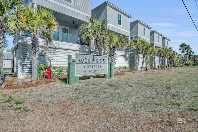 1592 W Beach Blvd, Gulf Shores, AL 36542 - community / neighborhood sign featuring a lawn