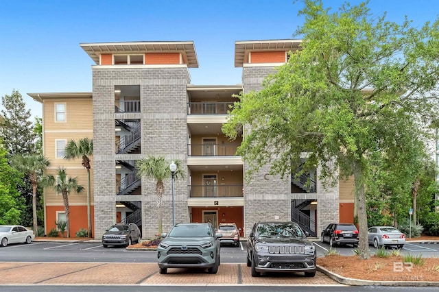 1430 Regency Rd Unit C201, Gulf Shores, AL 36542 - view of apartment building / complex featuring uncovered parking