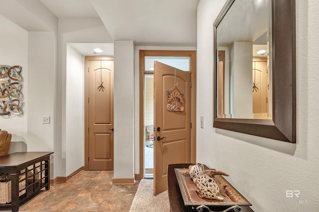 1430 Regency Rd Unit C201, Gulf Shores, AL 36542 - entrance foyer featuring baseboards and light stone finish flooring