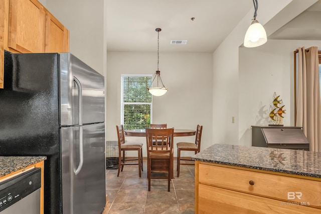 1430 Regency Rd Unit C201, Gulf Shores, AL 36542 - kitchen with appliances with stainless steel finishes, decorative light fixtures, and dark stone countertops