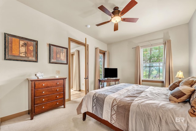 1430 Regency Rd Unit C201, Gulf Shores, AL 36542 - bedroom with light carpet and ceiling fan