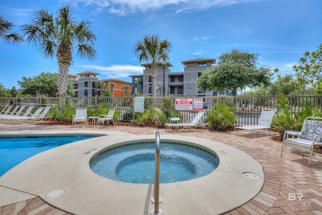 1430 Regency Rd Unit C201, Gulf Shores, AL 36542 - community pool featuring a patio area and a hot tub