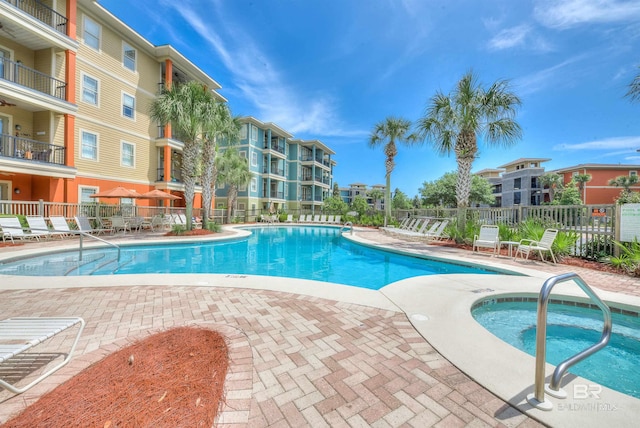 1430 Regency Rd Unit C201, Gulf Shores, AL 36542 - community pool with a patio area and a community hot tub