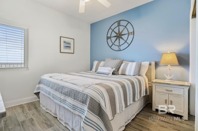 455 E Beach Blvd Unit 807, Gulf Shores, AL 36542 - bedroom with wood finished floors, ceiling fan, and baseboards