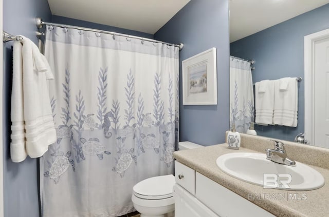 455 E Beach Blvd Unit 807, Gulf Shores, AL 36542 - bathroom with toilet, vanity, and curtained shower